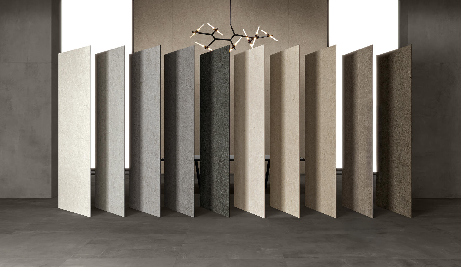 Row of ceramic tiles in various colors and textures against a neutral background