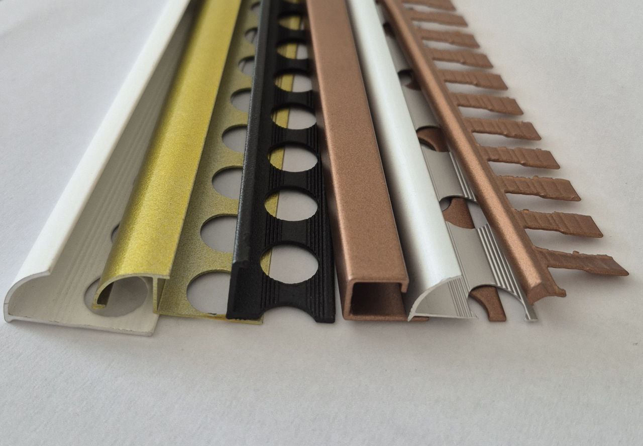 Set of metal profiles in various colors on a white background