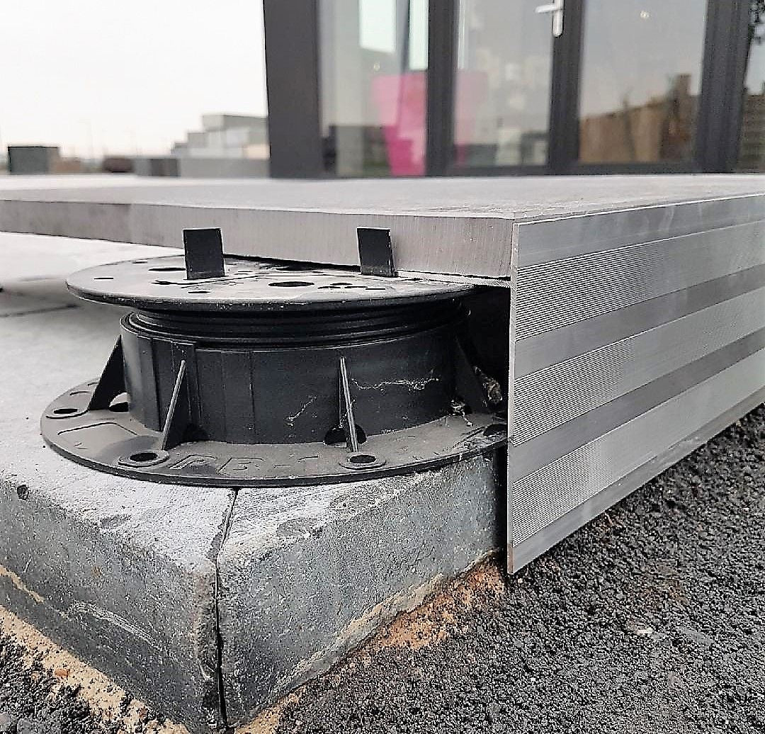 Modern building facade with geometric design against a blue sky